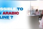 Image for a blog about learning Arabic online, showing a man in traditional Middle Eastern attire giving a thumbs-up in front of a laptop. The text 'Is it Possible to Learn Arabic Online?' is prominently displayed in bold blue and red fonts, with the Zabeel International logo and website URL (https://zabeelinstitute.ae/) at the bottom left.