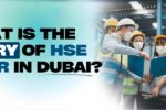 Graphic featuring a group of workers in safety gear reviewing a document in an industrial setting, accompanied by the text 'What is the salary of HSE officer in Dubai?' with the Zabeel International logo and website URL (zabeelinstitute.ae).