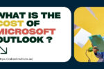 Blog banner with the text 'What is the cost of Microsoft Outlook?' in bold, colorful fonts. The banner also shows an image of a person typing on a keyboard on the left and a surprised woman holding documents on the right, with flying papers around her.