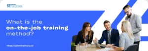 A group of professionals engaged in a discussion around a table, exploring the on-the-job training method.