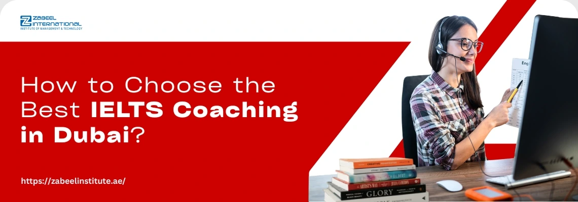 A woman in a plaid shirt sits at a desk with a computer and books, discussing IELTS coaching options in Dubai.