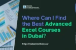 A collage of charts and graphs on a desk with a laptop, emphasizing the search for advanced Excel courses in Dubai.