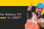 Two construction workers in safety vests and hard hats give thumbs up while discussing BIM Engineer salaries in the UAE.