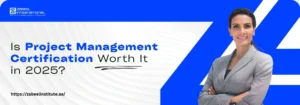 "Promotional banner from Zabeel International Institute with the text 'Is Project Management Certification Worth It in 2025?' featuring a confident businesswoman in a grey suit on a blue and white background. Best for topics on project management certification in Dubai, UAE, PMP courses, and career growth in 2025."