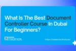 A bright blue and purple-themed banner asking a question. The banner is divided into three sections with rounded corners. The left section has a photo of a well-dressed man with grey hair, wearing glasses and a suit, looking at papers in front of a laptop. The middle section is a solid blue background with white text that reads "What Is The Best Document Controller Course In Dubai For Beginners?". The words "Document Controller Course" are highlighted in bold. The Zabeel International Institute of Management & Technology logo is in the bottom left of this section, and the website "https://zabeelinstitute.ae/" is in the bottom right. The right section of the banner shows a close-up photo of various papers, stamps, and an ink pad on a desk. The overall design is professional and visually appealing.
