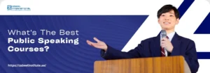 "صورة إعلانية لمعهد الزبيل الدولي تسأل عن أفضل دورات التحدث أمام الجمهور (Public Speaking). تُظهر الصورة متحدثاً واثقاً يلقي خطاباً من على منبر، مما يؤكد على أهمية التدريب على مهارات العرض والخطابة والتواصل الفعال لتحقيق النمو المهني."