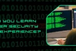 A person in a hoodie coding on multiple monitors with a binary code background; addressing the question "How Can You Learn Computer Security with No Experience?"
