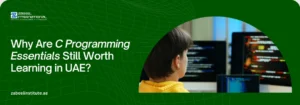 Why Are C Programming Essentials Still Worth Learning in UAE? Educational banner from Zabeel International Institute asking 'Why Are C Programming Essentials Still Worth Learning in UAE?', featuring a student viewing lines of code on multiple monitors to highlight C programming courses and software development training.