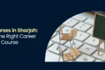 A miniature chalkboard and classroom desks set against a computer keyboard, representing the guide on professional courses in Sharjah at Zabeel Institute.