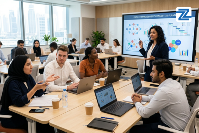 Diverse group of professionals participating in a CAPM certification training course at Zabeel International Institute, featuring a project management instructor leading a workshop in a modern classroom.